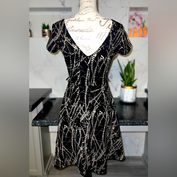 SMALL gently used, skater dress with side loops for a belt of your choice. - Picture 2 of 2